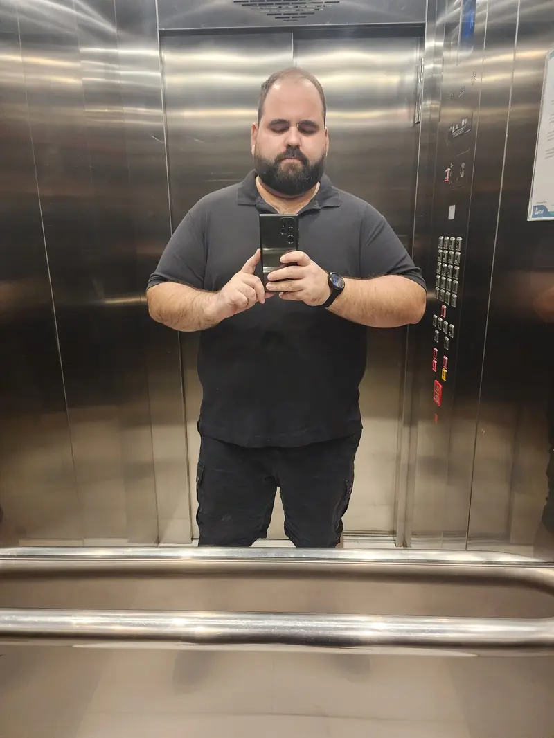 Renzo full-body elevator selfie in all black, March 2024