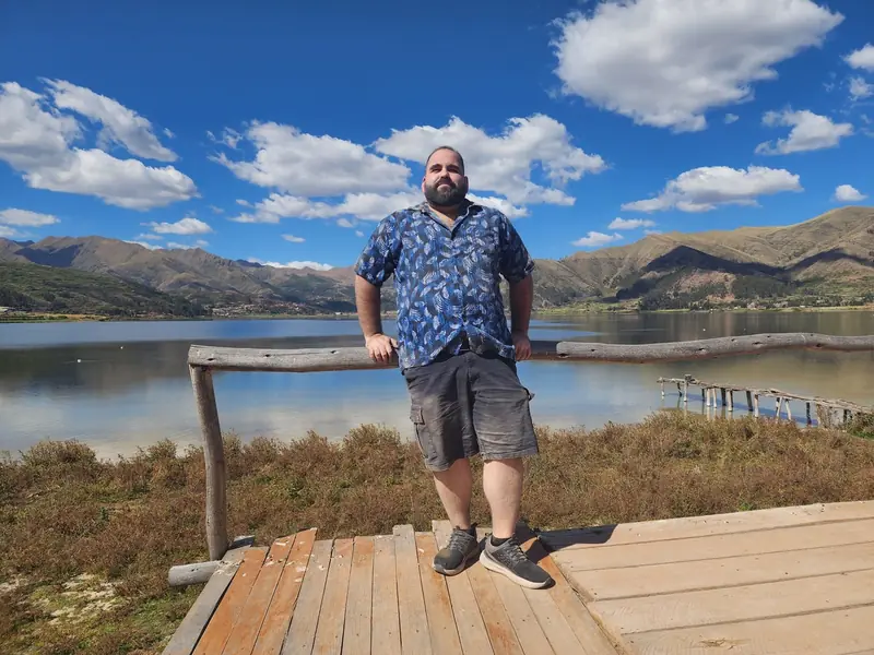 Renzo full-body outdoors at a lake, May 2024